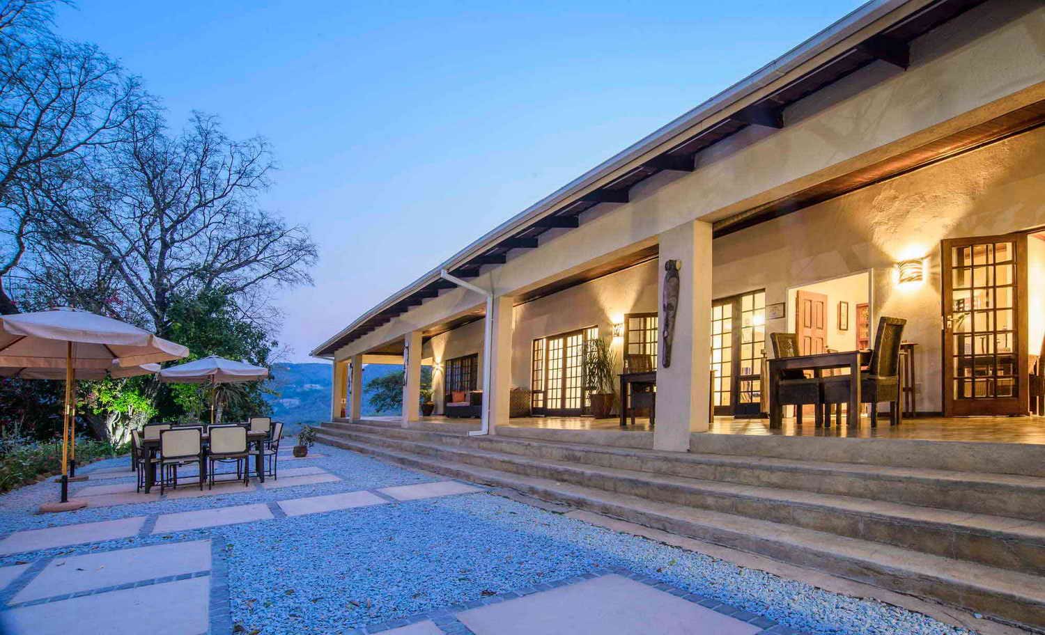 The lodge verandah glowing at dusk
